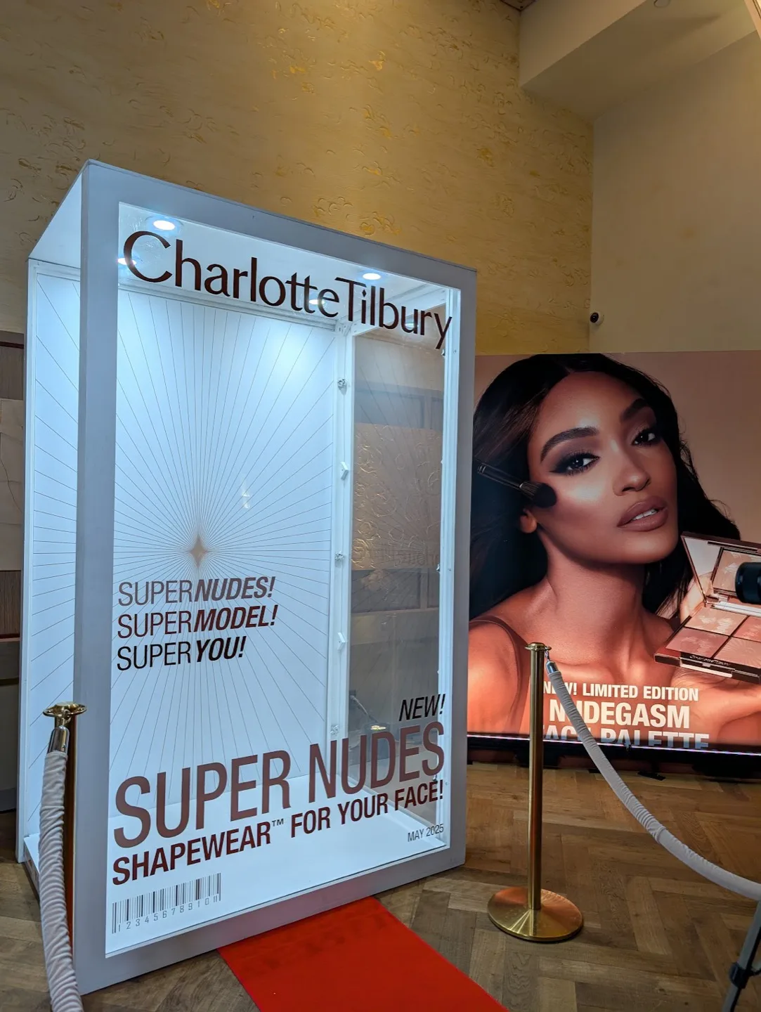 Charlotte Tilbury magazine photo booth setup at brand activation event