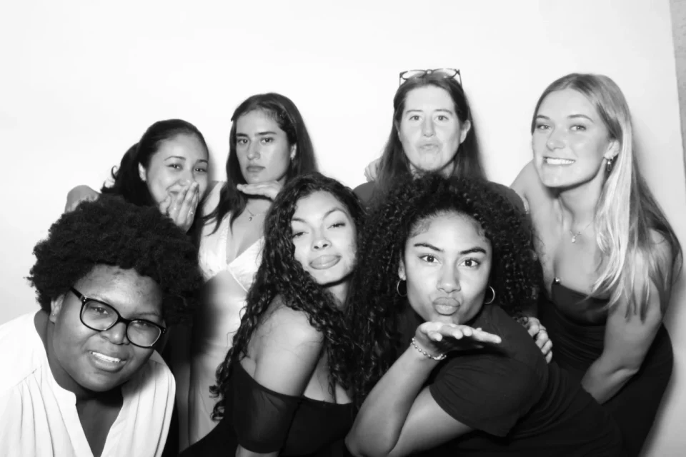 Black and white photo booth NYC — group of friends in a high-contrast monochrome portrait
