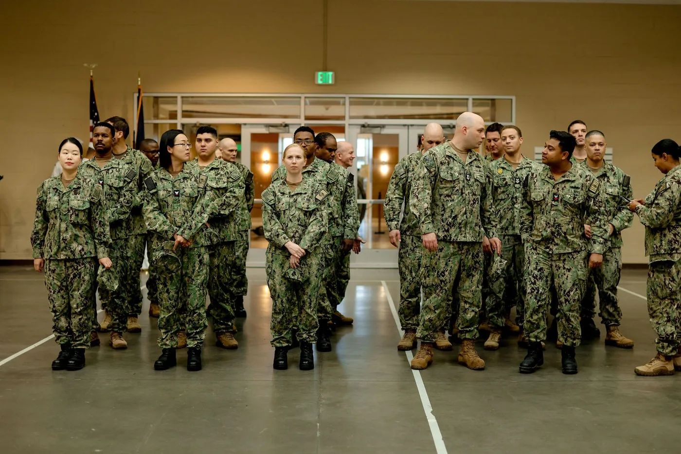 Service members entering in formation at a Navy change of command ceremony