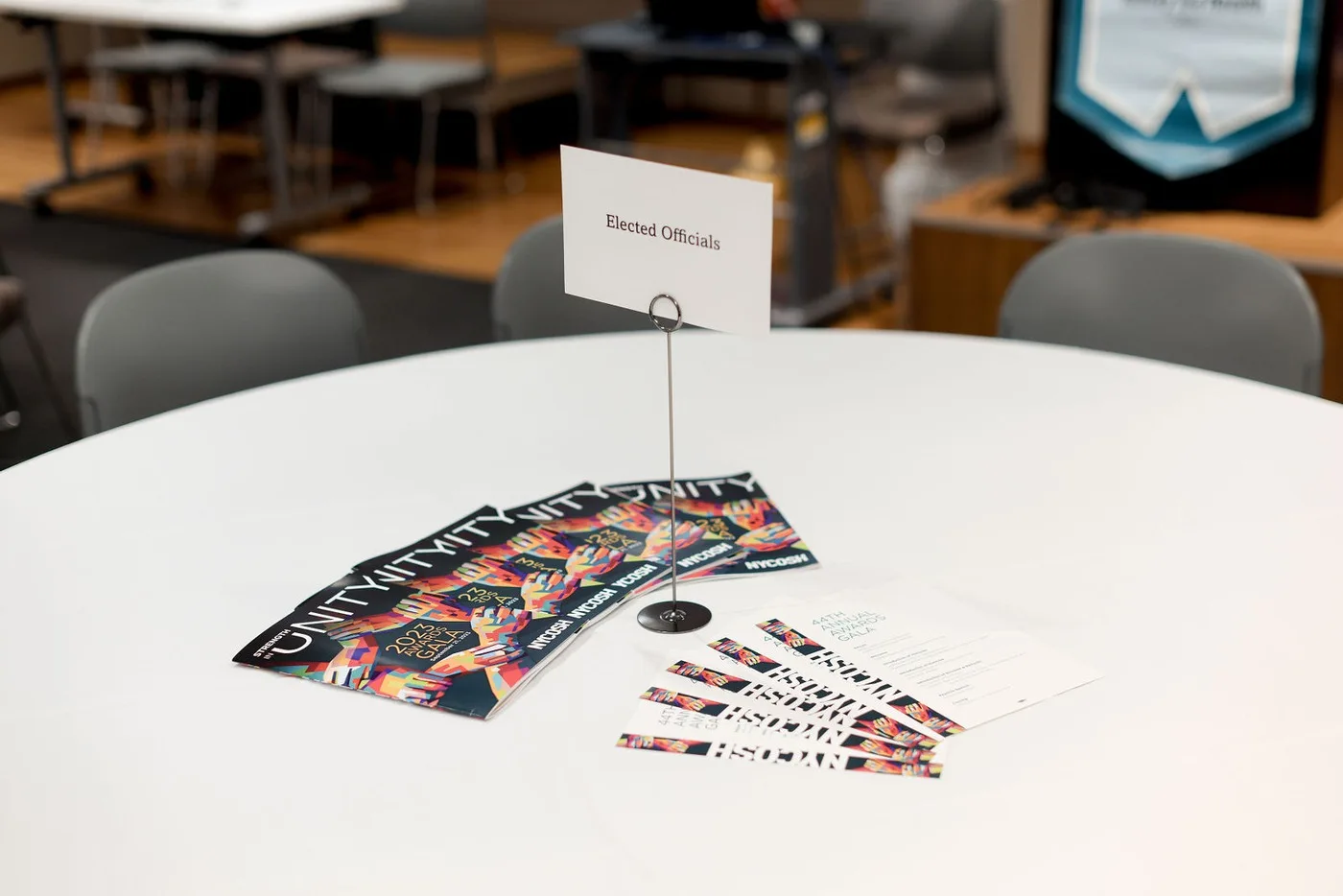 Branded event programs on a reception table at an NYC corporate awards gala