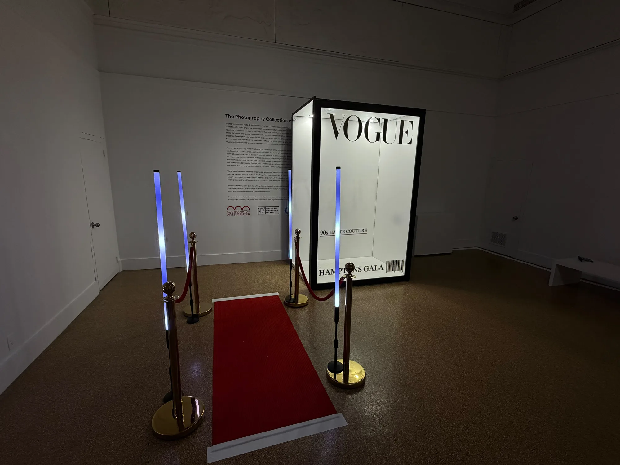 Magazine photo booth with a red carpet and lit stanchions at a Hamptons gala at Southampton Arts Center
