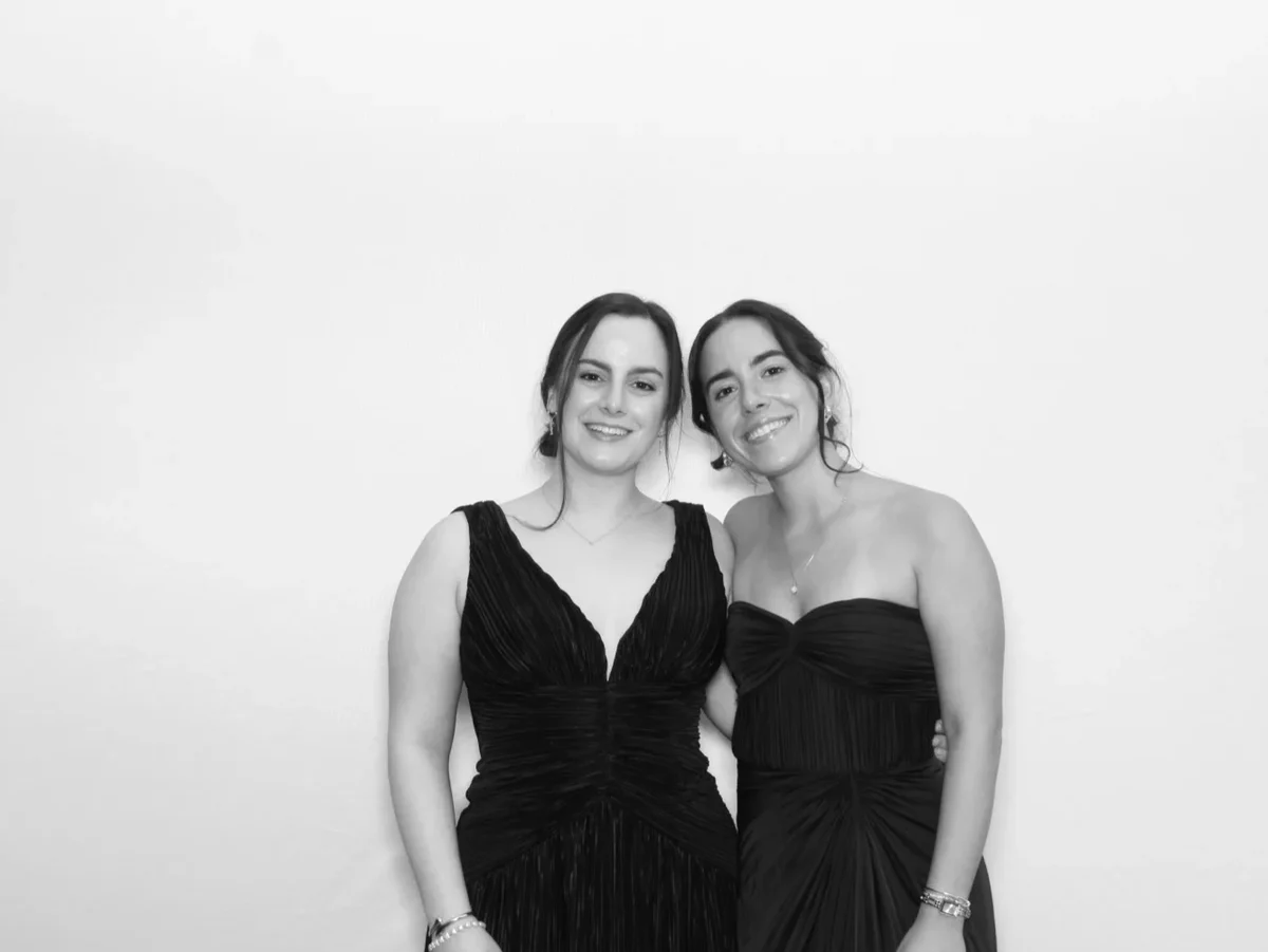 Glam photo booth black and white portrait of two guests in gowns at a New York gala