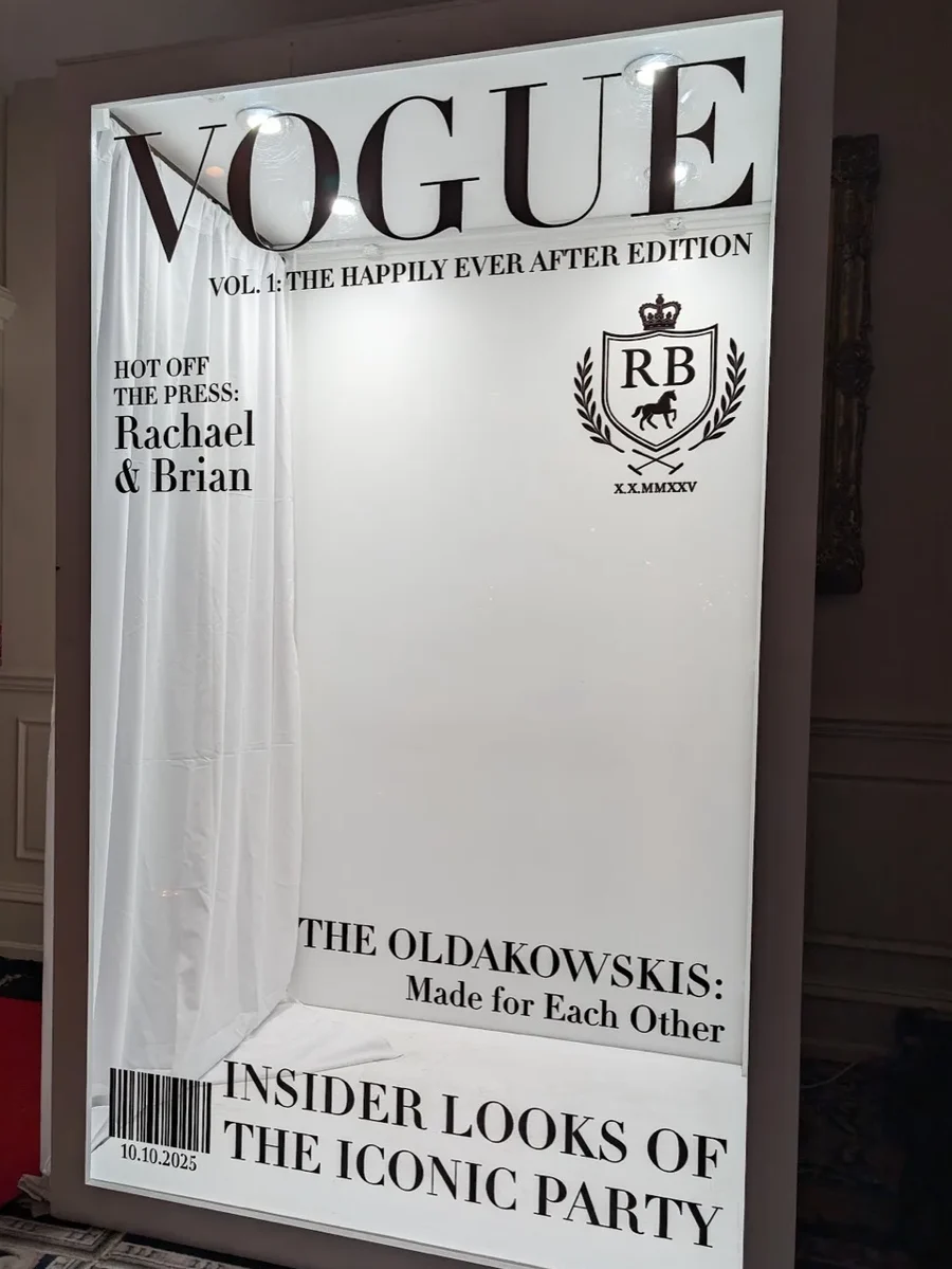 Walk-in magazine cover photo booth with a custom Vogue-style wedding cover at a New York reception